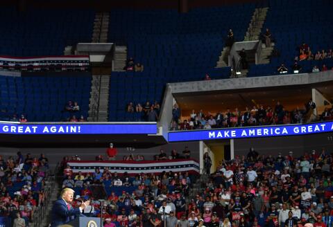 (FILES) In this file photo the upper section of the arena is seen partially empty as US President Donald Trump speaks during a campaign rally at the BOK Center on June 20, 2020 in Tulsa, Oklahoma. Legions of K-pop fans and TikTok users are taking credit for upending Donald Trump's weekend rally after block-reserving tickets with no intention to attend an event that was beset by an embarrassingly low turnout. - TO GO WITH AFP STORY by Maggy DONALDSON: "Online disruption of Trump rally highlights K-pop's political hustle" / AFP / Nicholas Kamm / TO GO WITH AFP STORY by Maggy DONALDSON: "Online disruption of Trump rally highlights K-pop's political hustle" 