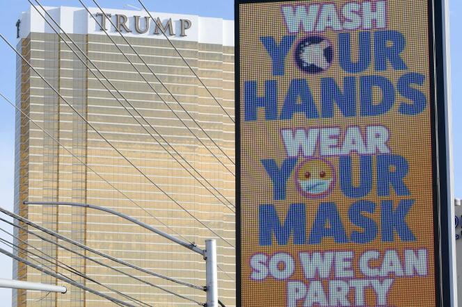 A Las Vegas (Nevada), un panneau affiche le message « Lavez-vous les mains, portez votre masque pour que nous puissions à nouveau faire la fête », le 26 juin 2020.