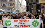 FILE PHOTO: People hold a banner during a protest march to call for action against climate change, as the spread of the coronavirus disease (COVID-19) continues, in Vienna, Austria, June 26, 2020. REUTERS/Leonhard Foeger/File Photo