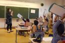 A teacher gives a lesson to the pupils at the Ziegelau elementary school in Strasbourg, eastern France, as primary and middle schools reopen in France on June 22, 2020. After six weeks of unsteady school sessions and more than three months of class at home to fight against the spread of the new coronavirus Covid-19, French pupils and middle school students return to class on June 22, thanks to a lighter health protocol. / AFP / FREDERICK FLORIN
