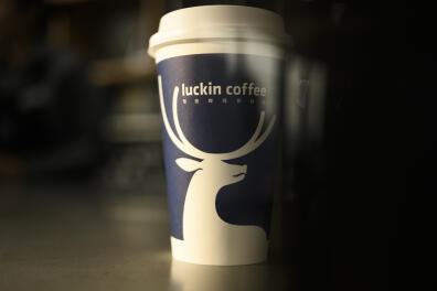 Picture of a cup of coffee at a Luckin Coffee on January 14, 2019. - When Starbucks came to China two decades ago it promised to open a new store every 15 hours. Now a homegrown rival, Luckin Coffee, plans to build a high tech-driven shop every three and a half hours to dethrone the US giant. The Chinese upstart is burning through millions of dollars to lure customers with steep discounts, challenging Starbucks' dominance by targeting office workers and students who prefer to have their java on-the-go or delivered to their doorstep. (Photo by Fred DUFOUR / AFP)
