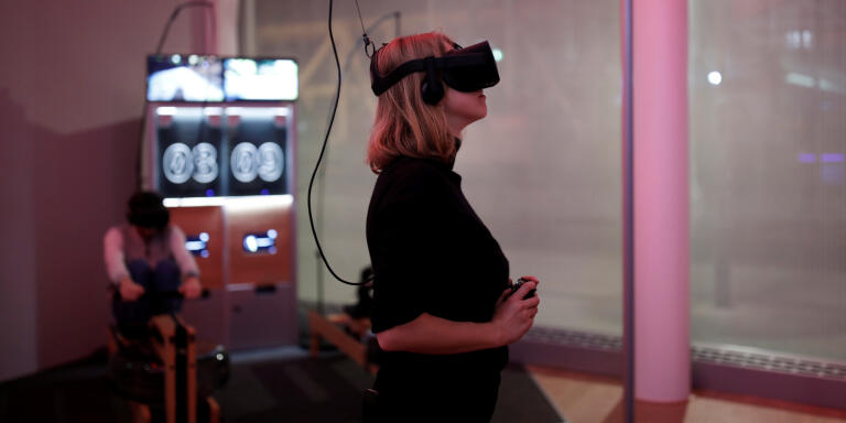 A woman plays a video game with the Oculus Rift VR headset at the mk2 VR, a place dedicated to virtual reality in Paris, France, December 5, 2016. REUTERS/Benoit Tessier - RC170F1B0F20