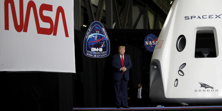 President Donald Trump stands on stage during an event at the Vehicle Assembly Building on Saturday, May 23, 2020, after viewing the SpaceX flight at NASA's Kennedy Space Center in Cape Canaveral, Fla. A rocket ship designed and built by SpaceX lifted off on Saturday with two Americans on a history-making flight to the International Space Station. (AP Photo/Alex Brandon)