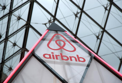 The Airbnb logo is seen on a little mini pyramid under the glass Pyramid of the Louvre museum in Paris, France, March 12, 2019. Airbnb and the Louvre museum will offer the chance to spend a night in the Louvre museum on April 30 where a contest winner with a guest will have an aperitif in front of the painting "Mona Lisa" (La Joconde) by Leonardo Da Vinci, a dinner in front of the Venus de Milo statue during a private visit and finally sleep in their own little mini pyramid under the glass Pyramid. Picture taken March 12, 2019. REUTERS/Charles Platiau - RC12045E05E0