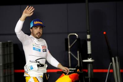 FILE PHOTO: McLaren driver Fernando Alonso of Spain waves to spectators in the pit during the qualifying session at the Yas Marina racetrack in Abu Dhabi, United Arab Emirates November 24, 2018. Luca Bruno/ Pool via REUTERS/File Photo