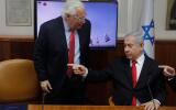 (FILES) In this file photo taken on July 28, 2019, Israeli Prime Minister Benjamin Netanyahu (R) talks with US Ambassador to Israel David Friedman after watching a video which shows the launch of the Arrow 3 hypersonic anti-ballistic missile during a cabinet meeting in Jerusalem. A fervent supporter of Jewish settlements in the West Bank, the US envoy to Israel has emerged as a central figure in the uncertainty surrounding Israel's annexation plans in the Palestinian territory. Friedman, a 61-year-old lawyer, has a long history of supporting West Bank settlements, communities considered illegal under international law. / AFP / POOL / MENAHEM KAHANA
