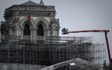 Workers take part in the dismantling operation of the scaffolding at the Notre-Dame Cathedral in Paris on June 8, 2020 that was damaged in the April 15, 2019 blaze. (Photo by Philippe LOPEZ / AFP)