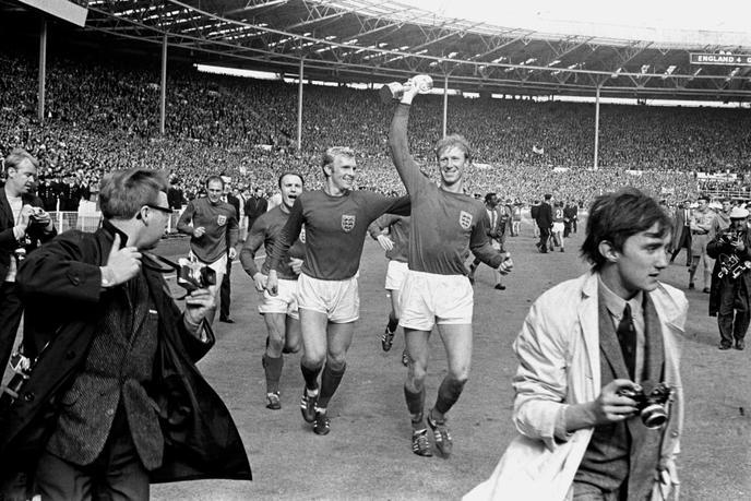 Jack Charlton, on the right, parade with the World Cup in hand, alongside his teammate Bobby Moore, at Wembley, July 30, 1966.