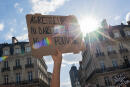 A protester holds a sign reading "Assailants, neither in the streets nor in power" a demonstration called by feminist movements in Nantes, western France, on July 10, 2020, to denounce the nomination of French Interior Minister, facing rape accusations and French Justice Minister who criticised the #MeToo movement against sexual harassment. (Photo by LOIC VENANCE / AFP)