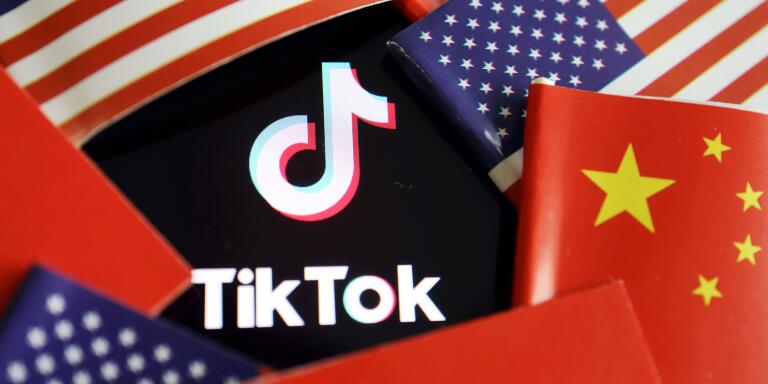 FILE PHOTO: China and U.S. flags are seen near a TikTok logo in this illustration picture taken July 16, 2020. REUTERS/Florence Lo/Illustration/File Photo