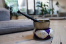 A bell sits on the floor of MNDFL mediation studio on August 24, 2017 in New York. - Loved by millions around the world, meditation promotes mental wellbeing through on concentration, breathing techniques and self-awareness. Its popularity in the West is owed in part to the Beatles, who promoted the practice on their return from India in the late 1960s. But these days, meditation can be found in all areas of life -- from hospitals exploring its benefits for patients with serious illnesses, to schools who recommend it for children and television shows. (Photo by DON EMMERT / AFP) / With AFP Story by Catherine TRIOMPHE: US-social-philosophy-lifestyle-meditation,FEATURE