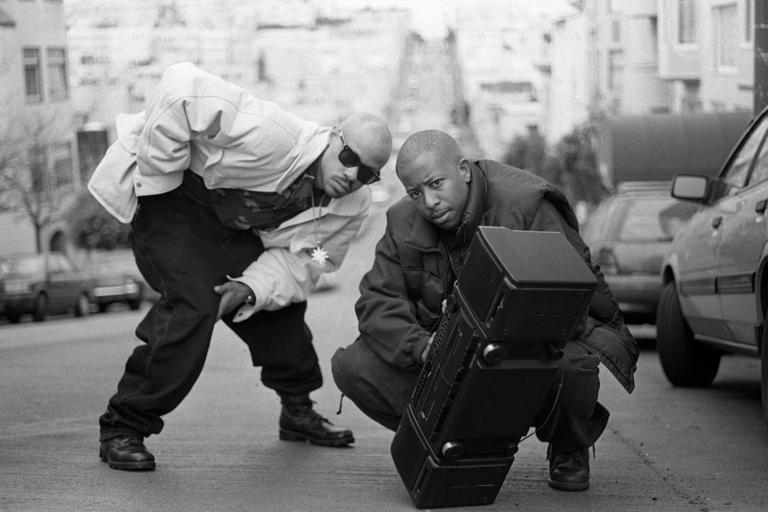 MARTYN GOODACRE / GETTY IMAGES Guru and DJ Premier of Gang Starr pose with a boombox, San Francisco, United States, 1991. (Photo by Martyn Goodacre/Getty Images)