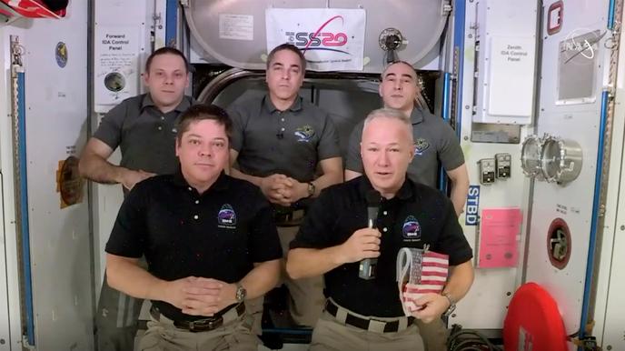 Astronauts Bob Behnken and Doug Hurley, foreground, during an interview on the International Space Station on August 1.