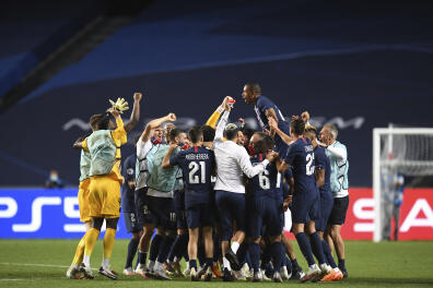 PSG players celebrate at the end of the Champions League semifinal soccer match between RB Leipzig and Paris Saint-Germain at the Luz stadium in Lisbon, Portugal, Tuesday, Aug. 18, 2020. (David Ramos/Pool Photo via AP)