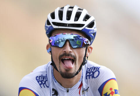 France's Julian Alaphilippe grimaces when crossing the finish line of stage 17 of the Tour de France cycling race over 107 kilometers (105.6 miles) from Grenoble to Meribel Col de la Loze, France, Wednesday, Sept. 16, 2020. (Stuart Franklin/Pool via AP)