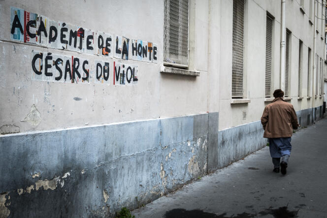 Devant des affiches « Académie de la honte, Césars du viol », en mars, à Paris.