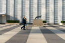 People walk past "The Knotted Gun" by Swedish sculpture Carl Fredrik ReuterswÃ¤rd, Monday, Sept. 21, 2020, at United Nations headquarters. In 2020, which marks the 75th anniversary of the United Nations, the annual high-level meeting of world leaders around the U.N. General Assembly will be very different from years past because of the coronavirus pandemic. Leaders will not be traveling to the United Nations in New York for their addresses, which will be prerecorded. Most events related to the gathering will be held virtually. No access to world leaders on the U.N. grounds will be possible, therefore, and access to most anything will be extremely curtailed. (AP Photo/Mary Altaffer)