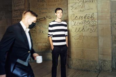 Berlin, Germany 17.09.2020, portrait of Torsten Menzel.
The Picture is taken in the Reichstag building. it is the meeting place of the German parliament: the Bundestag. https://en.wikipedia.org/wiki/Reichstag_building in the background Graffiti written in Cyrillic on the walls of the Reichstag building in 1945 by the Red Army. (https://www.bundestag.de/resource/blob/394562/e9b7fac699d80e1d5e2ec78813d15e62/flyer_graffiti-data.pdf) Johannes once worked for a member of the Bundestag ) In the left foreground is a usher of the German Parliament.