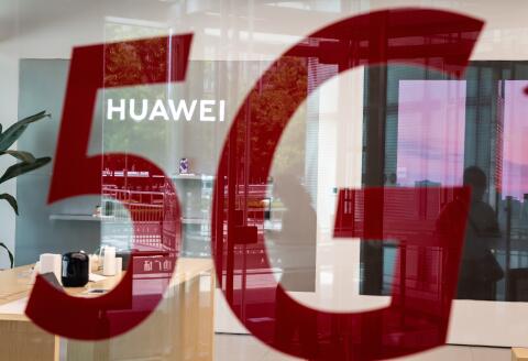 A shop for Chinese telecom giant Huawei features a red sticker reading "5G" in Beijing on May 25, 2020. (Photo by NICOLAS ASFOURI / AFP)