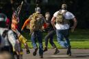 SALEM, OR - SEPTEMBER 07: Right wing demonstrators chase a Black Lives Matter protester after a pro-Trump caravan rally convened at the Oregon State Capitol building on September 7, 2020 in Salem, Oregon. The caravan event, billed as the Oregon For Trump 2020 Labor Day Cruise Rally, began in Clackamas and made its way to the Oregon State Capitol in Salem. David Ryder/Getty Images/AFP
== FOR NEWSPAPERS, INTERNET, TELCOS &amp; TELEVISION USE ONLY ==
