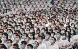 This photo taken on September 26, 2020 shows first-year students wearing masks as a preventive measure against the Covid-19 coronavirus during a commencement ceremony at Wuhan University in Wuhan, in China's central Hubei province. China OUT / AFP / STR 