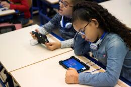 Schoolchildren use "GraphoLearn", an application on a digital tablet, to learn to read, in a primary school on January 8, 2018 in Marseille, southern France. (Photo by BERTRAND LANGLOIS / AFP)