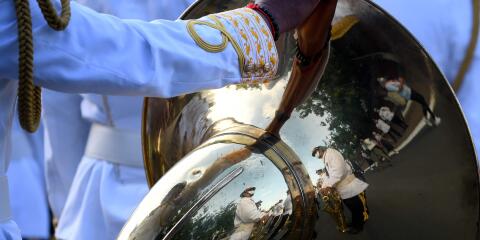 TOPSHOT - Honor guards are reflected on a horn during a ceremony marking Cambodia's Independence Day in Phnom Penh on November 9, 2020. Cambodia is celebrating its 67th anniversary of its independence from France in 1953. / AFP / TANG CHHIN Sothy
