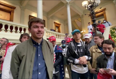 Right-wing media personality Nick Fuentes speaks to a crowd of Trump supporters during a 'Stop The Steal' gathering in the Georgia State Capitol, in Atlanta, Georgia, U.S., November 18, 2020, amid a manual recount of the state's ballots in the presidential election, in this still image taken from a video obtained from social media. Brendan Gutenschwager/via REUTERS THIS IMAGE HAS BEEN SUPPLIED BY A THIRD PARTY. MANDATORY CREDIT. NO RESALES. NO ARCHIVES.