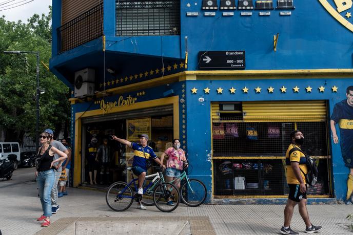 Fans and neighbors gather in front of the La Bombonea Stadium in Buenos Aires.
