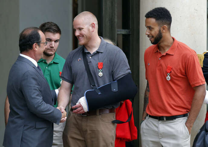 Spencer Stone (center), Aleksander Skarlatos and Anthony Sadler greeted by François Hollande at the Elysee Palace in Paris, August 24, 2015.
