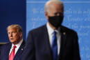 FILE - President Donald Trump, left, remains on stage as then-Democratic presidential candidate former Vice President Joe Biden, right, walks away Thursday, Oct. 22, 2020, at Belmont University in Nashville, Tenn. President Trump's extraordinary effort to overturn Joe Biden's win in Wisconsin returns to the courtroom on Friday, Dec. 11, 2020 with hearings in federal and state lawsuits seeking to invalidate hundreds of thousands of ballots and give the GOP-controlled Legislature the power to name Trump the winner. (AP Photo/Julio Cortez, file)