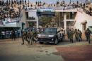 The motorcade of the President of the Central African Republic, arrives at the 20,000-seat stadium, for an electoral rally, escorted by the presidential guard, Russian mercenaries, and Rwandan UN peacekeepers, in Bangui, on December 19, 2020. One week before the first round of the presidential election, scheduled on December 27, 2020, the security situation is deteriorating rapidly and the United Nations Multidimensional Integrated Stabilisation Mission in the Central African Republic (MINUSCA) is on high alert. / AFP / ALEXIS HUGUET
