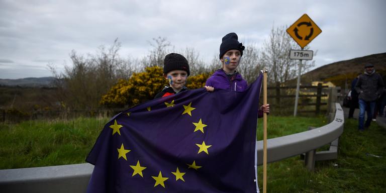 People attend a protest against Brexit at the border crossing between the Republic of Ireland and Northern Ireland in Carrickcarnon, Ireland March 30. 2019. REUTERS/Clodagh Kilcoyne - RC1F97B85140