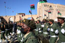 Members of the Libyan armed forces take part in a parade to mark the country's 69th anniversary of independence, at the Martyrs Square of the GNA-held Libyan capital Tripoli, on December 24, 2020. (Photo by Mahmud TURKIA / AFP)