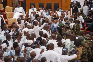 Ghanaian soldiers are seen at the parliament of Ghana during a misunderstanding between members of parliament in Accra, Ghana on January 7, 2021. Ghanaian soldiers intervened overnight to quell a clash between opposing parties in parliament ahead of the body's swearing-in set for January 7, 2021, witnesses said.
Chaotic scenes erupted after a ruling party deputy tried to seize the ballot box during the vote for parliament speaker. The ensuing clash lasted several hours until the army stepped in, with national television broadcasting the drama live. / AFP / Nipah Dennis 