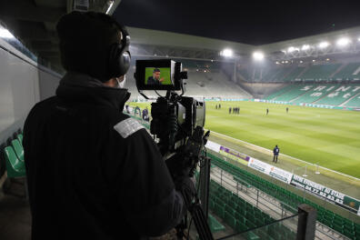 Soccer Football - Ligue 1 - AS Saint-Etienne v Paris St Germain - Stade Geoffroy-Guichard, Saint-Etienne, France - January 6, 2021 A camera operator is pictured ahead of the match REUTERS/Gonzalo Fuentes