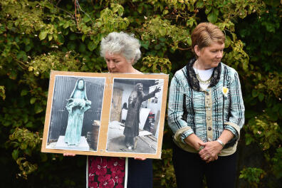 FILE: Report Reveals Scale of Abuse at Mother and Baby Homes in Ireland TUAM, IRELAND - AUGUST 25: Tuam Mother and Baby home survivor Carmel Larkin (L) and historian Catherine Corless (R) who has compiled information concerning the deaths of children in Tuam stand beside one another as a vigil is held at the Tuam Mother and Baby home mass burial site on August 25, 2019 in Tuam, Ireland. Nearly 800 babies and young children who died in the Tuam Home run by the Bon Secours order of nuns for unmarried mothers are buried there in unmarked graves. The vigil was held to highlight the government's delay in progressing legislation to allow for the excavation of the site, a year after a similiar vigil was held to coincide with the visit of Pope Francis in nearby Knock. The home was one of 10 Irish institutions run by religious orders, to which about 35,000 unmarried pregnant women were sent. It is thought a child died there almost every two weeks between the mid-1920s and 1960s. (Photo by Charles McQuillan/Getty Images)