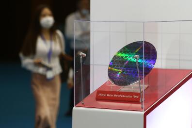 NANJING, CHINA - AUGUST 26: A 300mm wafer is on display at the Taiwan Semiconductor Manufacturing Company (TSMC) stand during 2020 World Semiconductor Conference at Nanjing International Expo Center on August 26, 2020 in Nanjing, Jiangsu Province of China. (Photo by Yang Bo/China News Service via Getty Images)