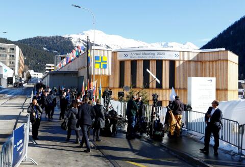 A combination picture shows a view of the congress centre at the Promenade street amid the coronavirus disease (COVID-19) outbreak in Davos, Switzerland on January 22, 2021 (top), and people walking in front of the congress centre, the venue of the World Economic Forum (WEF), in the Alpine resort of Davos, Switzerland on January 22, 2020. REUTERS/Arnd Wiegmann