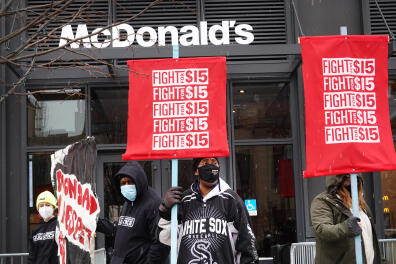 CHICAGO, ILLINOIS - JANUARY 15: Demonstrators participate in a protest outside of McDonald's corporate headquarters on January 15, 2021 in Chicago, Illinois. The protest was part of a nationwide effort calling for minimum wage to be raised to $15-per-hour. Scott Olson/Getty Images/AFP