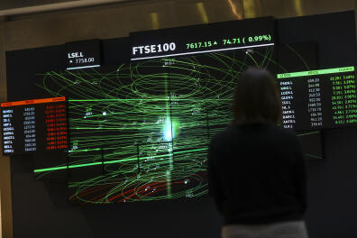 An employee views a FTSE share index board in the atrium of the London Stock Exchange Group Plc's offices in London, U.K., on Thursday, Jan. 2, 2020. Stocks started the year on the front foot, building on strong gains for many asset classes in 2019 as investors cheered the latest policy move by Chinas central bank to support its economy. Photographer: Simon Dawson/Bloomberg via Getty Images