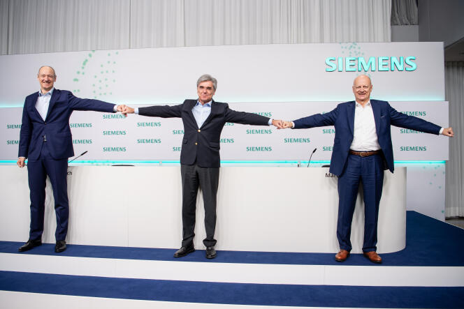 Joe Kaeser (au centre), PDG de Siemens jusqu’au 3 février 2020, avec Roland Busch (à gauche), son successeur.