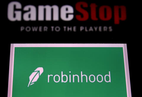 (FILES) In this file photo illustration taken on January 28, 2021, shows the logos of video grame retail store GameStop and trading application Robinhood in a computer and on a mobile phone in Arlington, Virginia. - The SEC on January 29, 2021, said its regulators were keeping an eye on the whipsawing share prices of some Wall Street stocks that had been targeted by a social media-driven campaign intended to make wealthy hedge funds suffer. (Photo by Olivier DOULIERY / AFP)