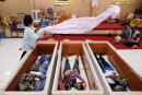 Devotees lie down and pray inside coffins to trick death and improve their luck at a temple in Bangkok, Thailand January 27, 2021. Picture taken January 27, 2021. REUTERS/Soe Zeya Tun TPX IMAGES OF THE DAY