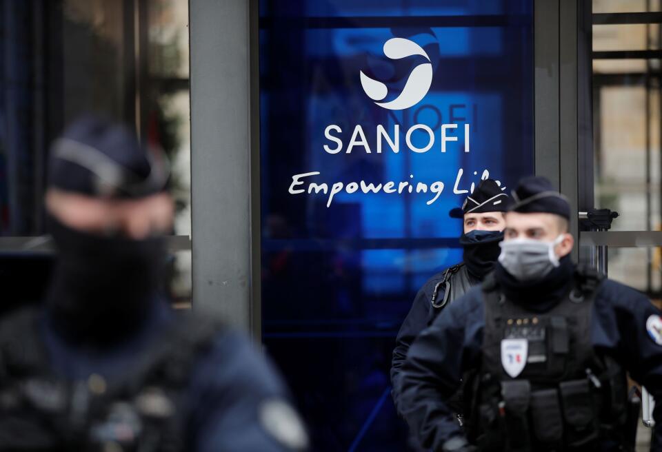 French police stand in front of the Sanofi headquarters during a protest by Sanofi's workers against job cuts in Paris as part of a national day of strikes and protests against layoffs and government's economic and social policies amid the coronavirus disease (COVID-19) outbreak in France, France, February 4, 2021. REUTERS/Benoit Tessier