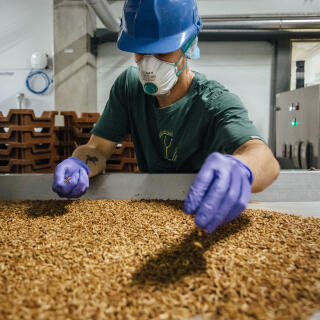 An employee loads larvae into a sorting oven inside the Ynsect insect farm in Dole, France, on Tuesday, May 19, 2020. A year before the Covid-19 pandemic caused havoc in the worlds food supply, venture capitalists plunged $125 million into mealworm breeding company Ynsect. Photographer: Cyril Marcilhacy/Bloomberg via Getty Images