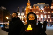 A woman holds up a luminous bird on February 14, 2021 in Moscow, during a peaceful rally in support of imprisoned Russian opponent Alexei Navalny.