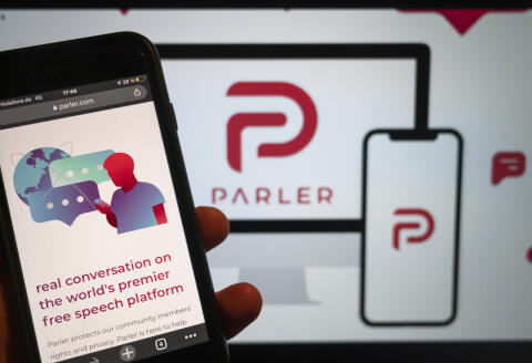 FILE - In this Jan. 10, 2021, file photo, the website of the social media platform Parler is displayed in Berlin. The right-wing friendly social network Parler, which was forced offline following the Jan. 6 attack on the U.S. Capitol by supporters of then-President Donald Trump, said it is re-launching, Monday, Feb. 15, 2021. (Christophe Gateau/dpa via AP, File)