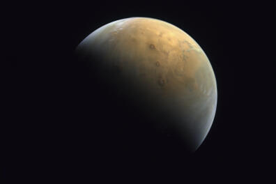 This Feb. 10, 2021 image taken by the United Arab Emirates' "Amal," or "Hope," probe was released Sunday, Feb. 14, 2021, shows Mars . The Hope space probe now circles the red planet. (Mohammed bin Rashid Space Center/UAE Space Agency, via AP)