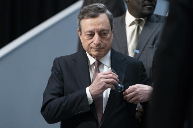 Mario Draghi, president of the European Central Bank (ECB), arrives for an International Monetary Fund (IMF) governors group photo at the spring meetings of the International Monetary Fund (IMF) and World Bank in Washington, D.C., U.S., on Saturday, April 13, 2019. The International Monetary Fund warned governments not to rock the boat with trade wars and other disruptions at a time when the global economy is already sailing through choppy waters. Photographer: Joshua Roberts/Bloomberg via Getty Images